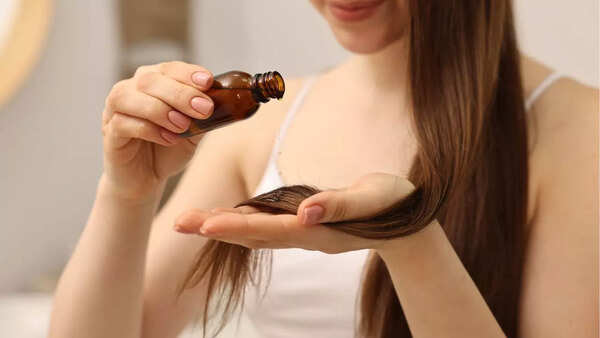 Woman massaging hair oil into her scalp