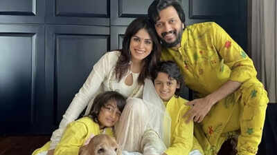 Riteish Deshmukh with his sons, Riaan and Rahyl, posing for the paparazzi
