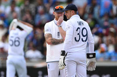 Ben Stokes and Jamie Smith strategize during a break in play.