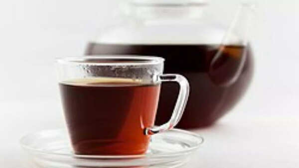 A cup of Rooibos tea with reddish hue