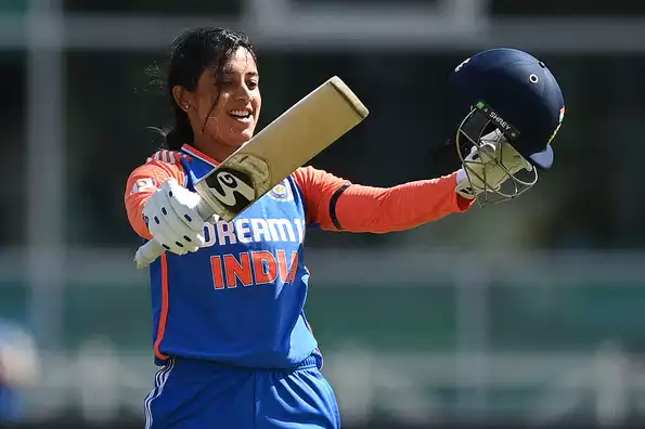 Smriti Mandhana celebrates her century against England.